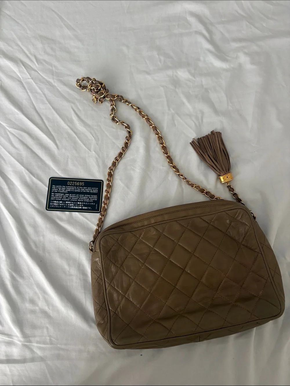 CHANEL Quilted Brown Leather Shoulder Bag with Gold-Tone Chain & Tassel